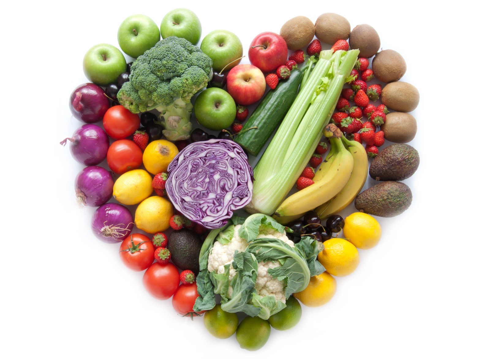 Colorful fruits and vegetables arranged in a heart shape — a healthy diet supports macular health