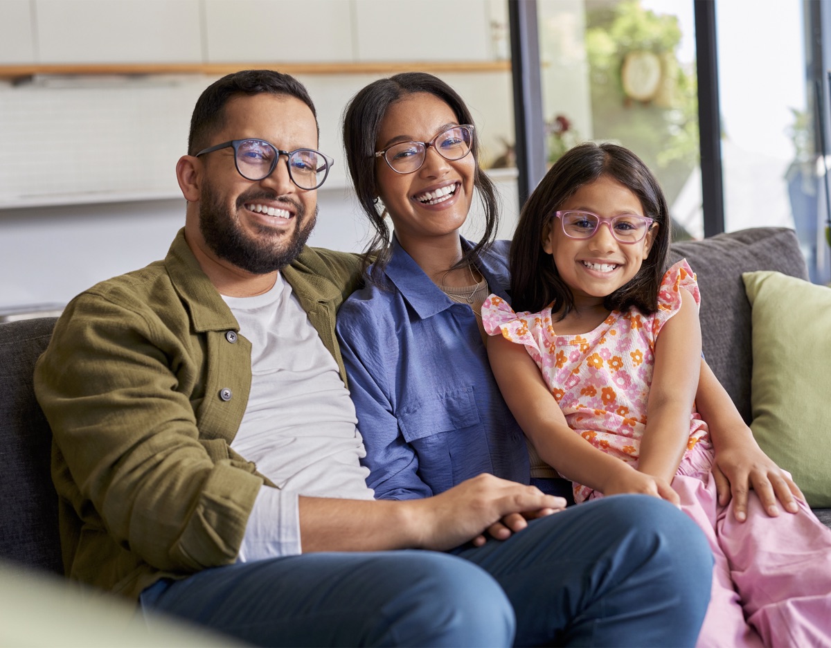 Family wearing glasses, smiling together